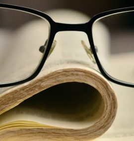 LearnOnline Self-study IGCSE Religious Studies - book with glasses on top