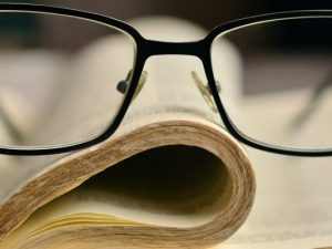 LearnOnline Self-study IGCSE Religious Studies - book with glasses on top