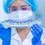 Women in STEM. Person in laboratory holding samples