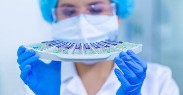 Women in STEM. Person in laboratory holding samples