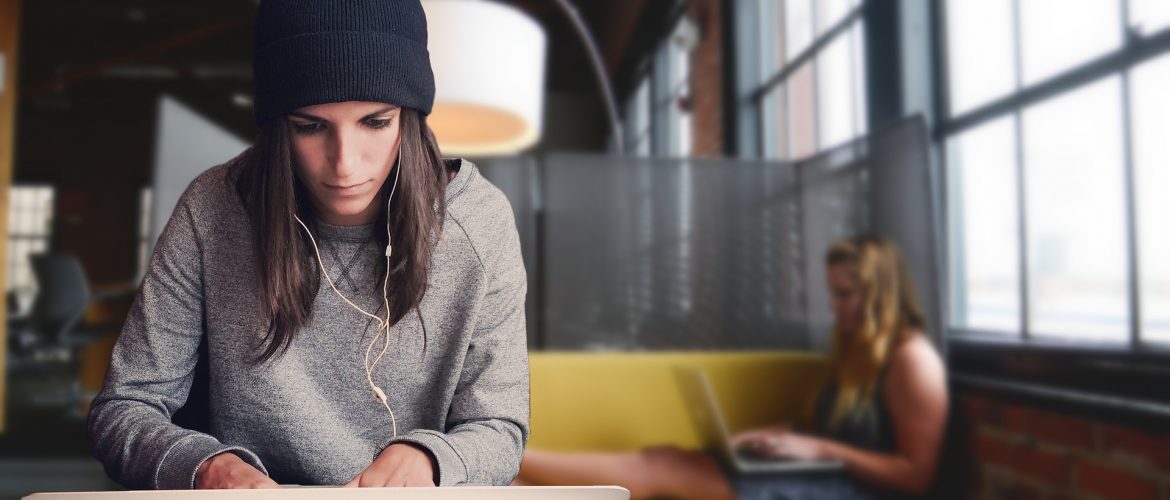 Fast Track A levels. 18-20 year old sat at laptop with someone in the background also on laptop