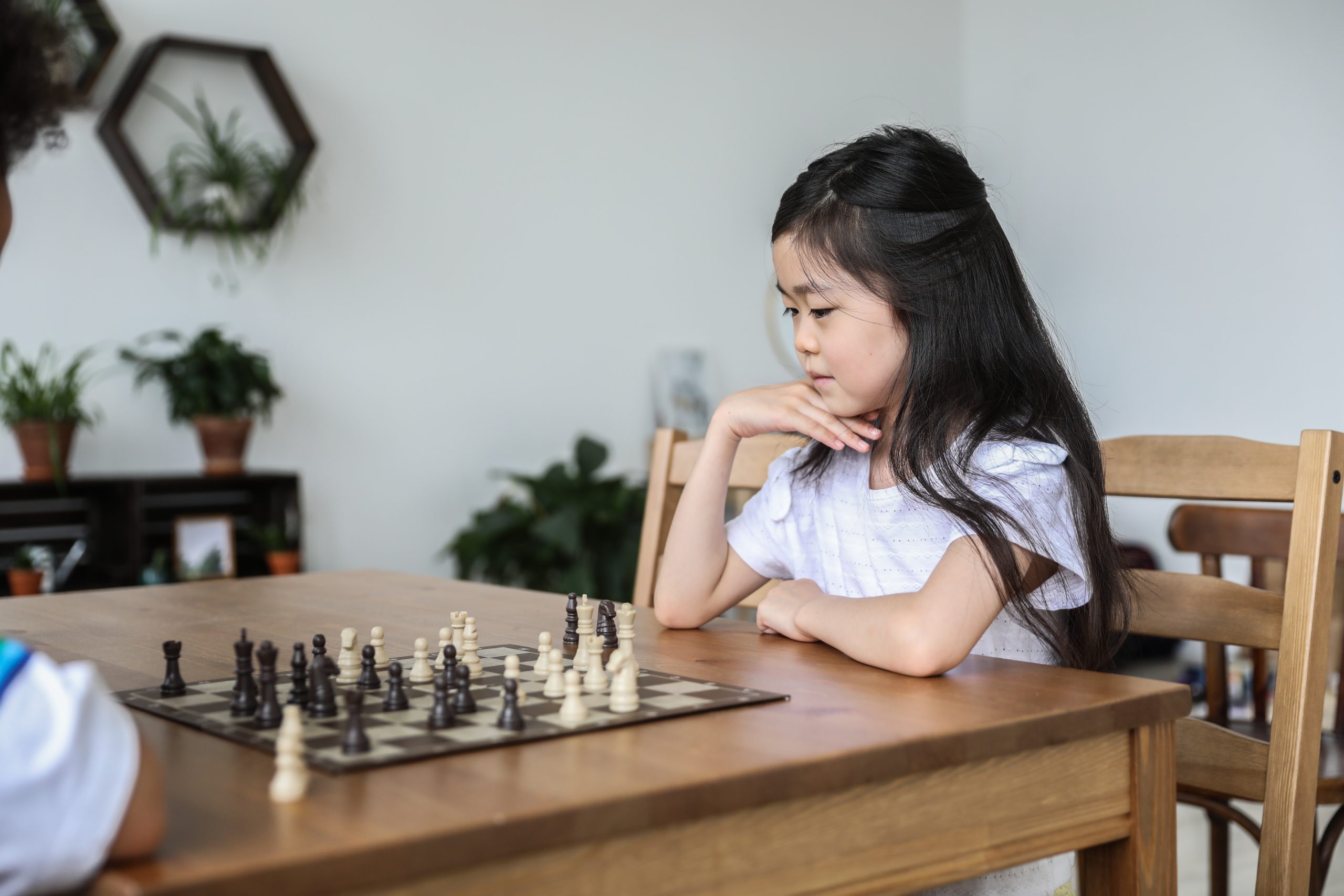 LearnOnline Home Education - how many subjects to follow? Child playing the game Chess