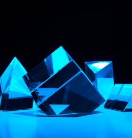 LearnOnline Mathematics Higher IGCSE Artistic image of cube and triangular shaped prisms