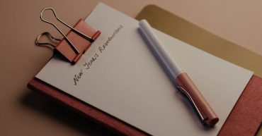 New Year's Resolutions Clip board with new year's resolutions written on it