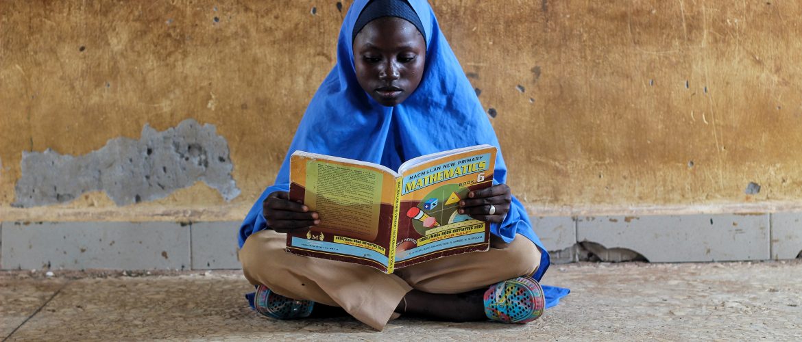 International Day of Education 2023 Girl reading maths book