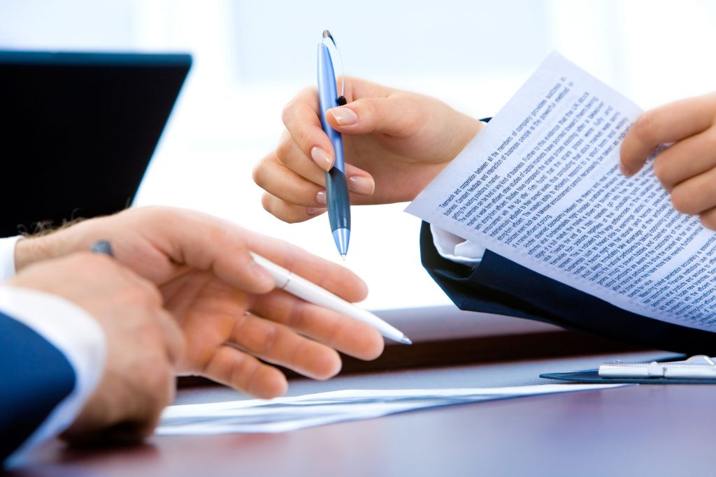 LearnOnline Fast Track Business A level Self-study Two people with pens and documents