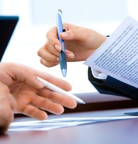 LearnOnline Fast Track Business A level Self-study Two people with pens and documents