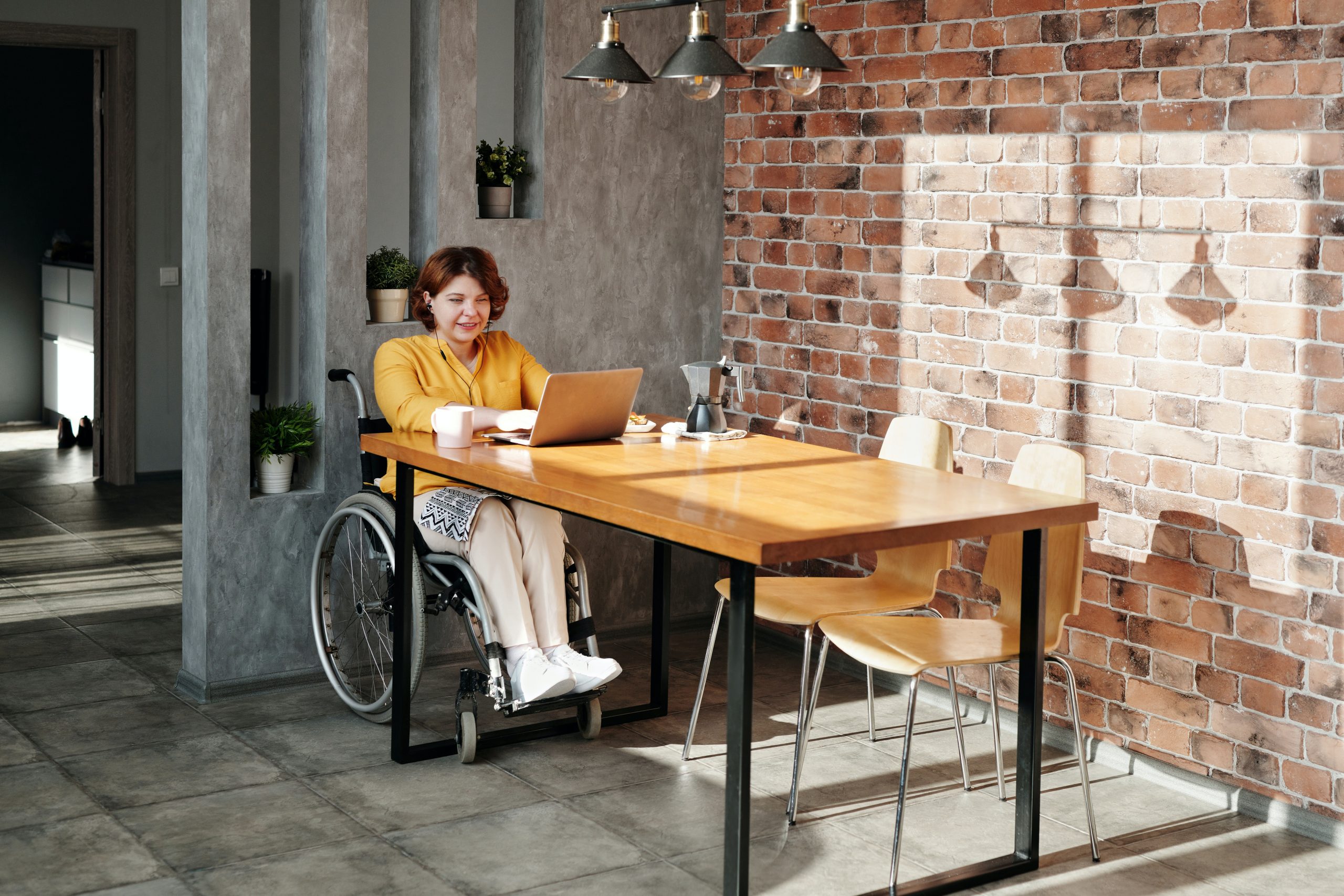 What is LearnOnline? What is LearnOnline? 16-20 year old sat at desk in wheelchair with laptop and coffee